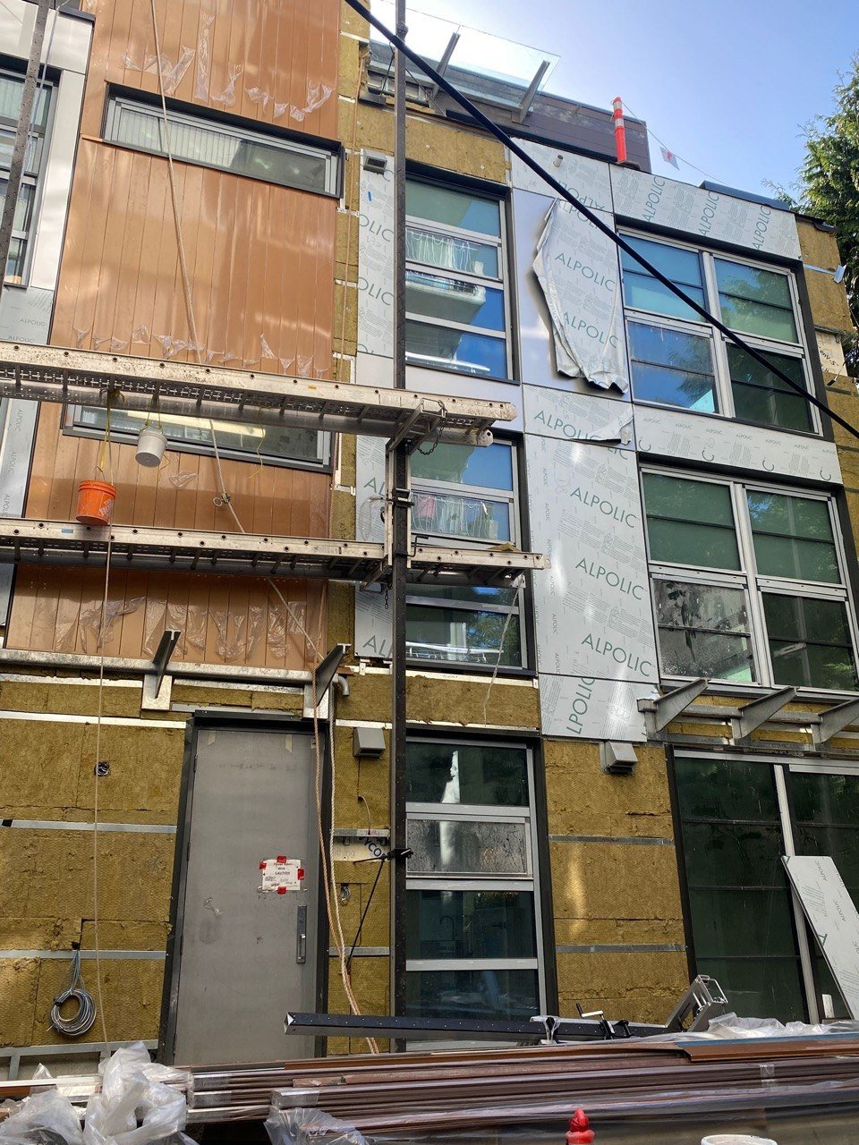 1188 Burnaby ALPOLIC panel and wood accent installation in progress