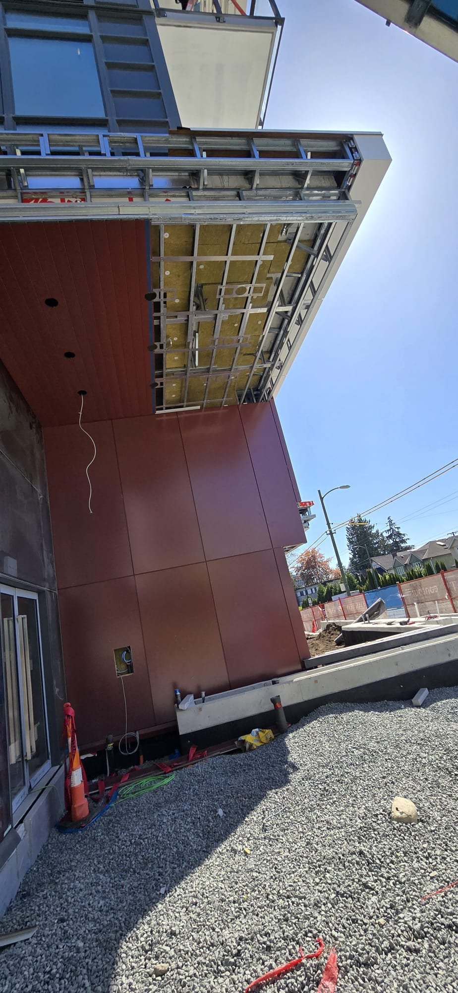 North Side red soffit panels and mineral-wool insulation detail