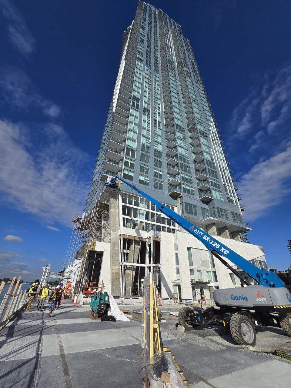 Pier West high-rise tower with boom lift — New Westminster
